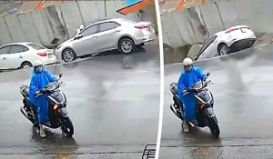 Τρύπα σε δρόμο «καταπίνει» εργάτη και δύο αυτοκίνητα! (Bίντεο)